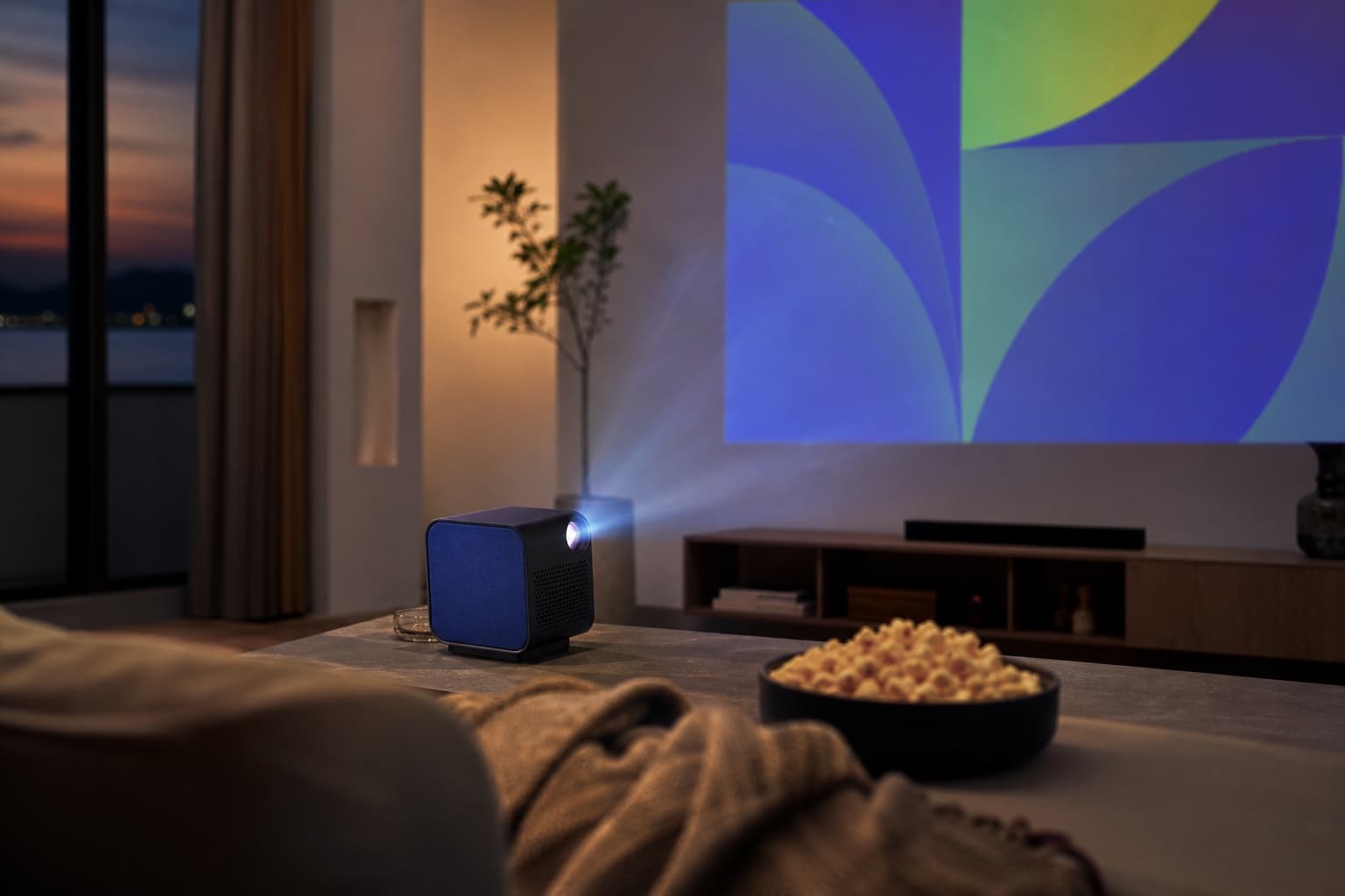 PocketBeam projecting a film in a living room